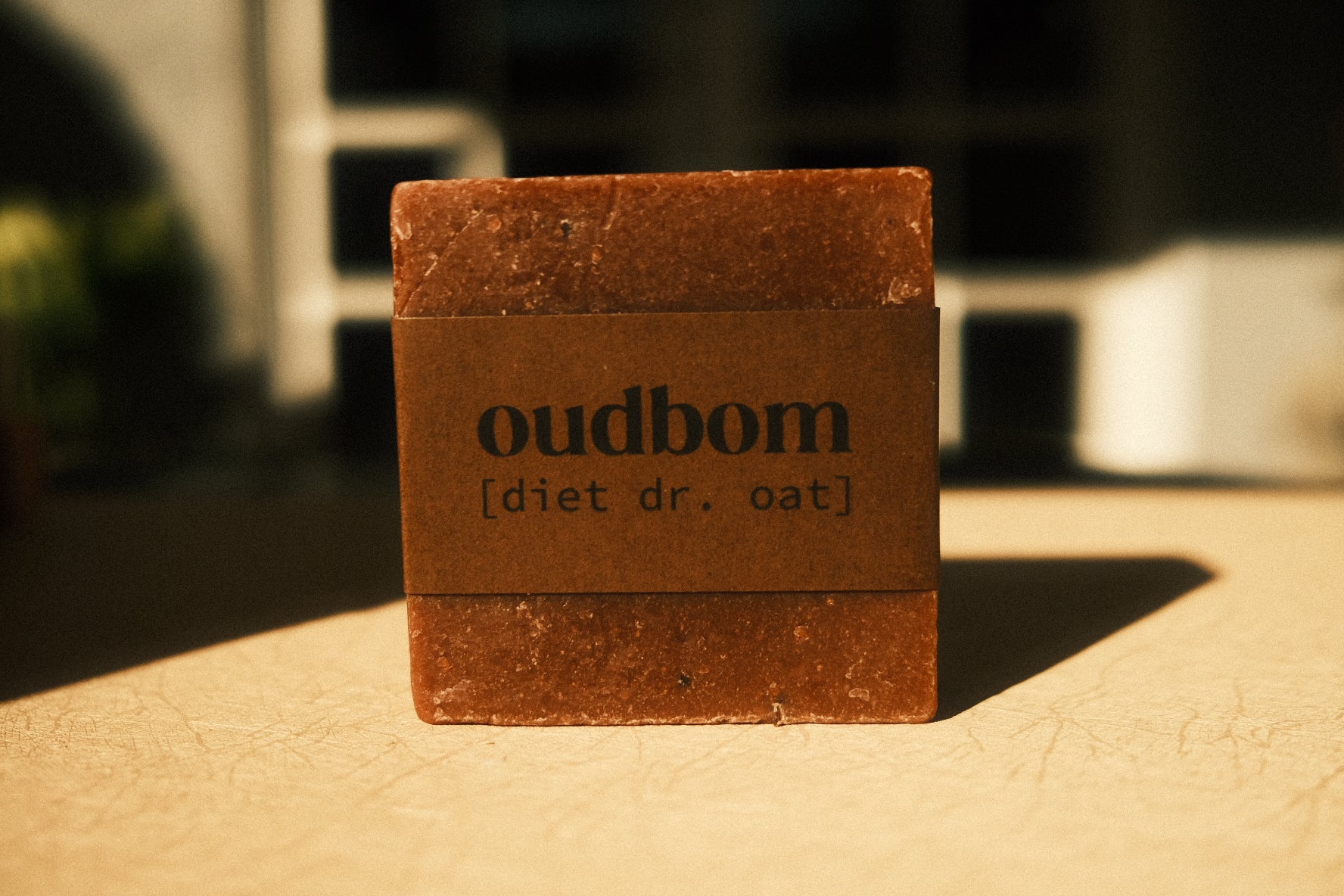 Bar of brown soap with a brown label, “oudbom, diet dr. oat”