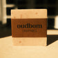 Bar of tan soap with a brown label, “oudbom, EEFOC”